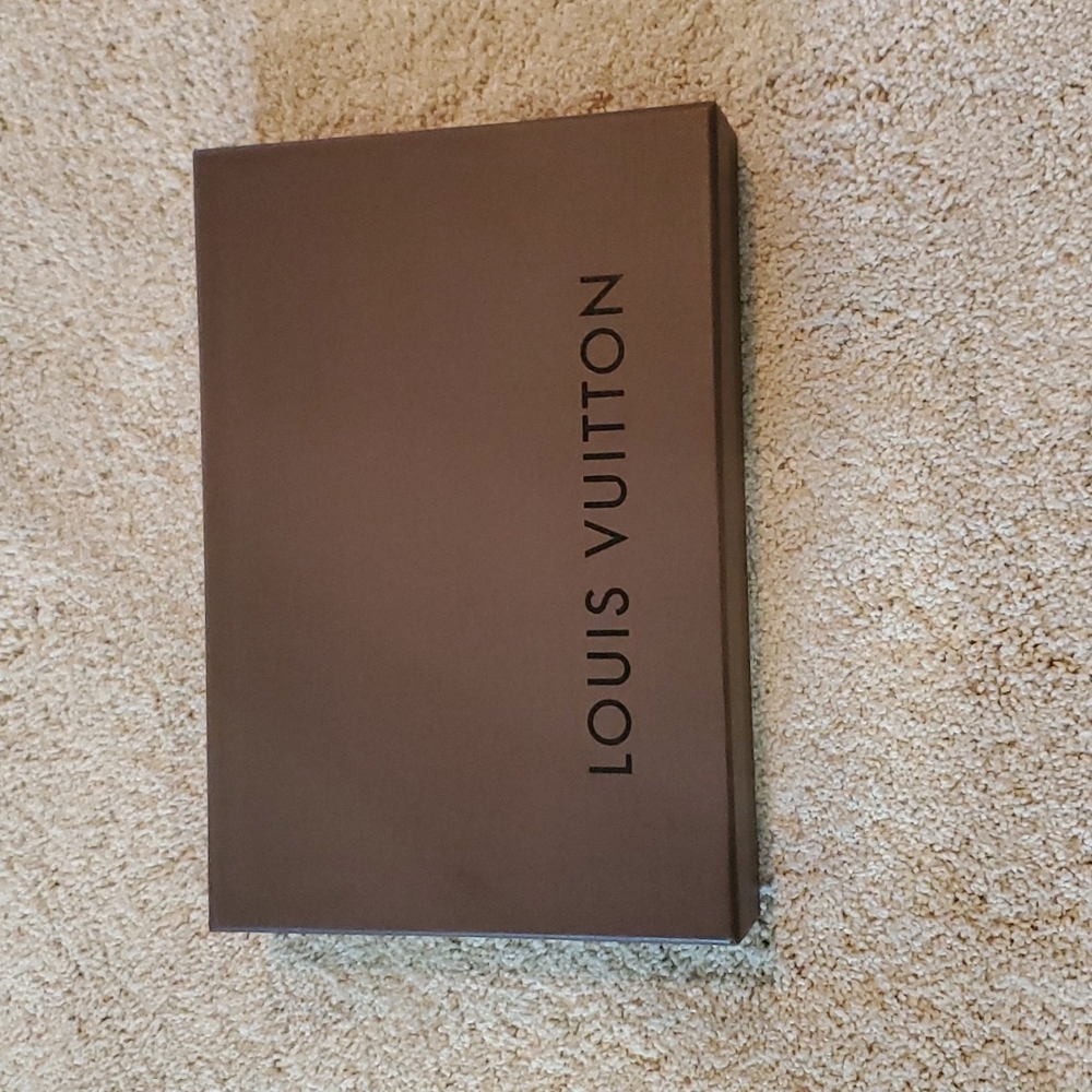 Louis Vuitton box with small duster bag and tissue paper.